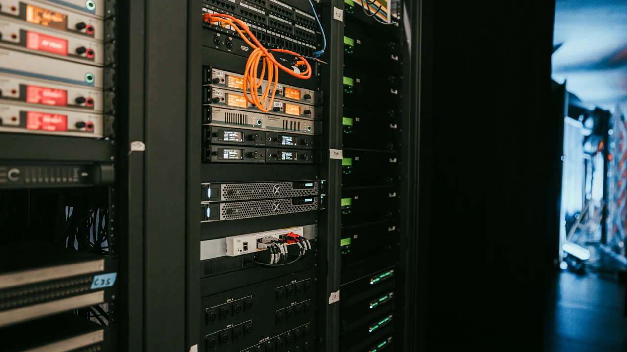 Institute lab: a rack seen from the aisle, its cable run down the face, wide and quiet.